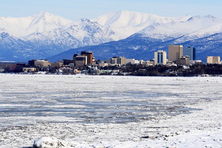 Visit Anchorage, Alaska: A vibrant city surrounded by mountains, offering outdoor adventures, cultural attractions, and stunning views.