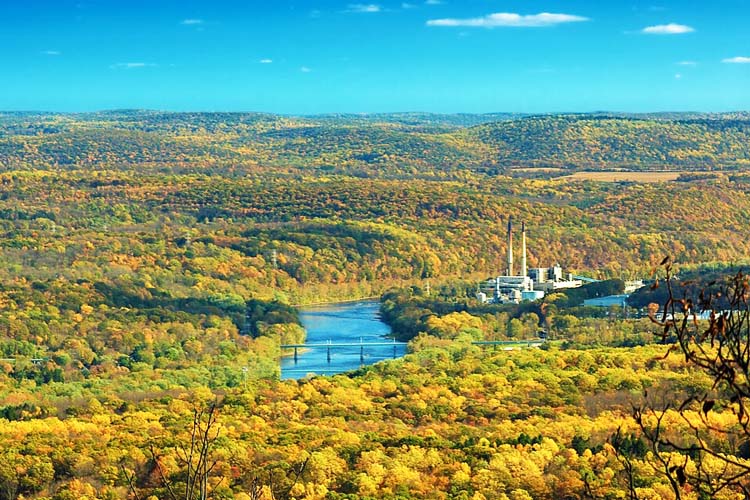 A scenic view of the Appalachian Trail, showcasing a winding path through vibrant autumn foliage and rugged landscapes, inviting hikers to experience the beauty Best Travel Destinations in Pennsylvania