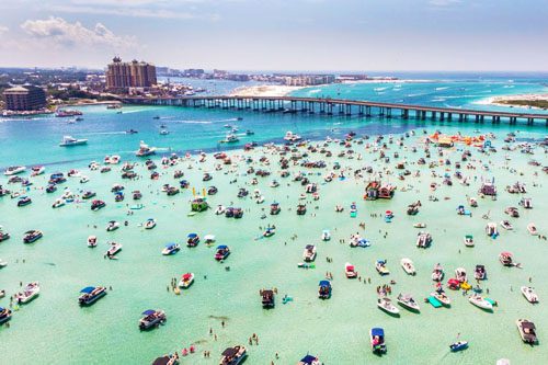 Enjoy a day at Crab Island, a popular destination in Destin, Florida, known for its clear waters, floating restaurants, and vibrant atmosphere for relaxation. Things to Do in Destin, Florida Crab Island