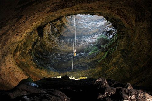 Devil's Sinkhole State Natural Area features a massive, 400-foot deep sinkhole, offering stunning views and a unique habitat for birds and wildlife. Devil’s Sinkhole State Natural Area-min