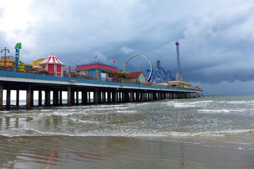 Galveston: Gulf Coast gem with sandy beaches, historic architecture, and the famous Pleasure Pier for seaside fun and entertainment. Galveston-min