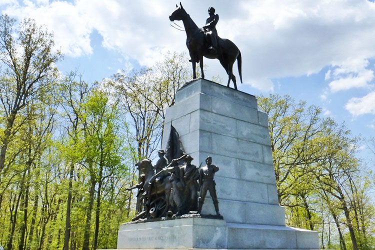 Best Places to Visit in Pennsylvania A historic view of Gettysburg National Military Park, solemn monuments, evoking the memory of the famous Civil War battlefield.