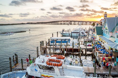 Visit HarborWalk Marina in Destin, Florida, where vibrant dining, shopping, and water activities converge, offering a lively atmosphere by the waterfront. HarborWalk Marina