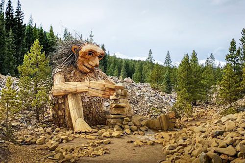 Meet Isak Heartstone: Breckenridge's iconic wooden troll sculpture nestled in the forest, a must-see Colorado attraction for families and art lovers alike. Unmissable Activities in Breckenridge, Colorado Isak Heartstone Colorado