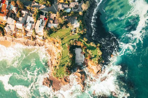 Relax at Laguna Beach, known for its beautiful coves, art galleries, and vibrant marine life, offering a perfect blend of nature and culture. Laguna Beach is the quintessential Southern California seaside escape