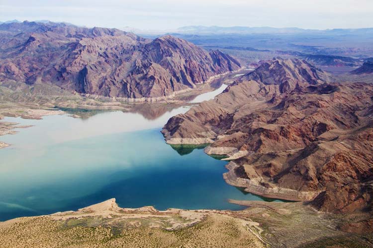 Lake Mead, part of the National Recreation Area, features striking desert landscapes, boating, fishing, and nearby Hoover Dam views. Lake Mead is a vast reservoir created by the Hoover Dam