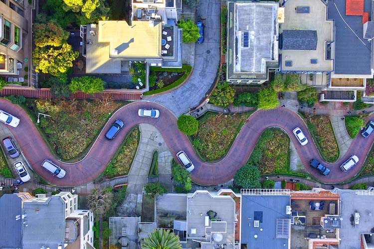 Experience Lombard Street, famously known as the 'crookedest street in the world,' with its charming gardens and beautiful views in San Francisco. Lombard Street, known as the “crookedest street in the world