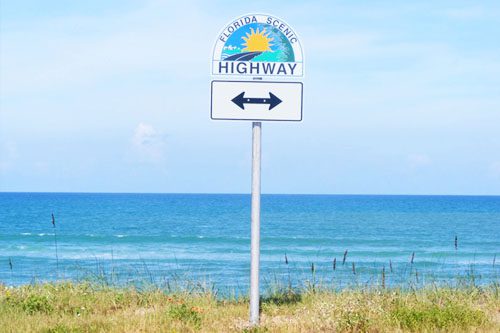 Drive along Scenic Highway 30A: A picturesque Florida route known for its stunning coastal views, charming beach towns, and outdoor adventures. Scenic Highway 30A-min