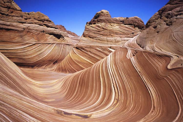 Discover The Wave in Arizona, a stunning sandstone rock formation known for its undulating patterns and vibrant colors, perfect for photography enthusiasts. Top sites to discover in Arizona The Wave is a breath-taking geological wonder