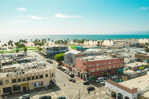 Experience the vibrant Venice Boardwalk, where eclectic shops, street performers, and stunning beach views create a lively coastal atmosphere. venice boardwalk california-min Exploring the Best of Southern California